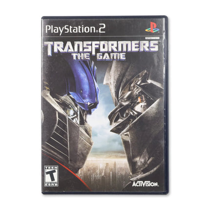 Transformers: The Game for Sony PlayStation 2 - Case front cover - Complete in box or case and game.